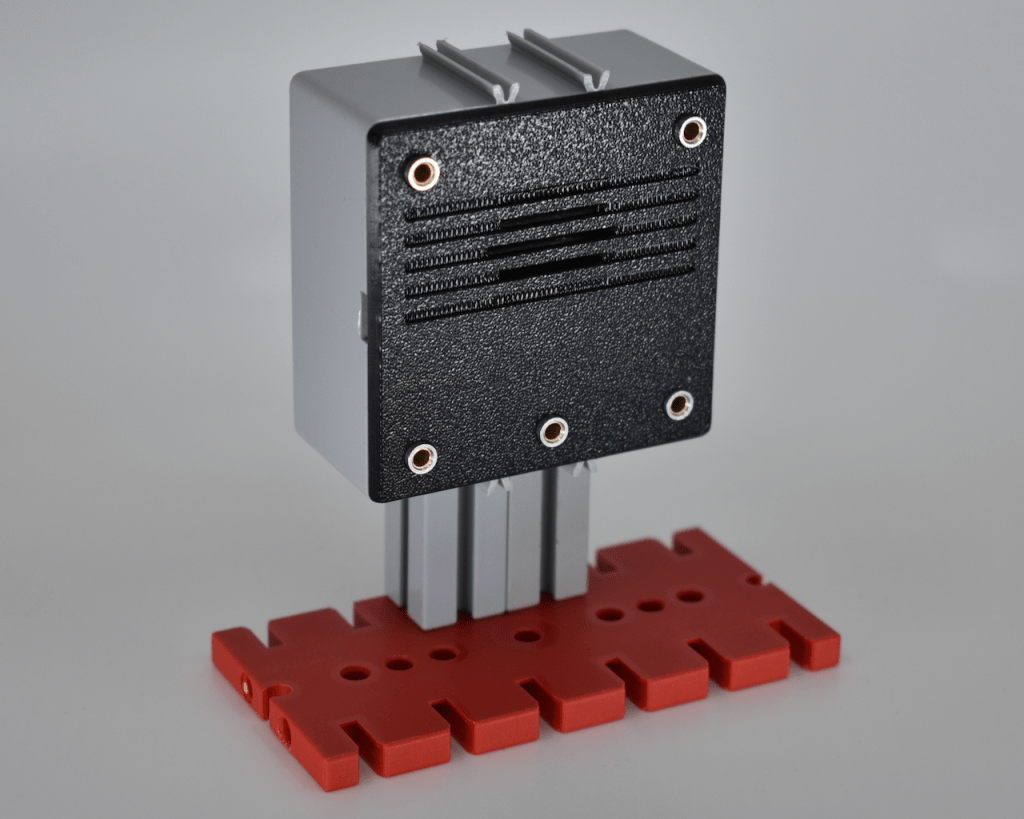 Prototype of a 3D printed speaker module fit into fischertechnik cassette bottom.
